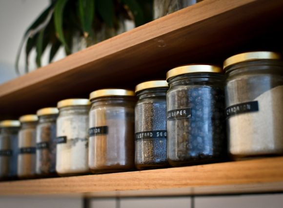 Pantry - a shelf filled with lots of different types of spices