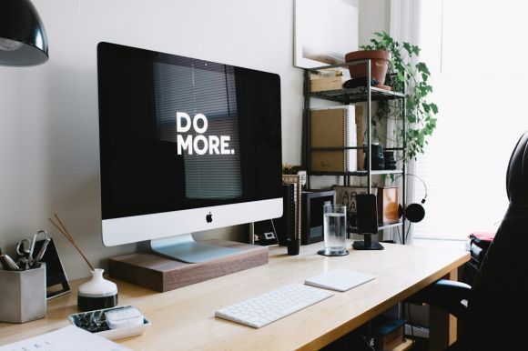 Home Gadget - silver iMac with keyboard and trackpad inside room
