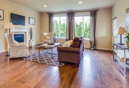 Hardwood Floors - a living room filled with furniture and a fire place