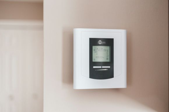 Heating System - white and gray thermostat at 19 5