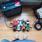 Cables Home - assorted guitar pedal lot beside electric guitar and amplifie