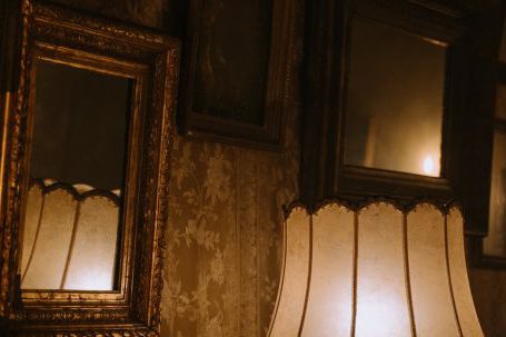 Vintage Mirrors - Brown Wooden Framed Wall Mirrors Near a Table Lamp