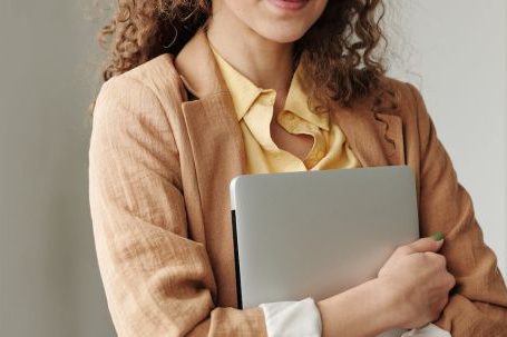 Smart Technology Retrofit - Woman Holding a Laptop
