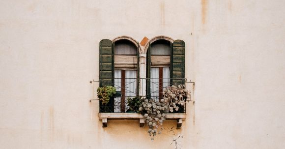 Window Shutters - Green Wooden Window on White Concrete Wall